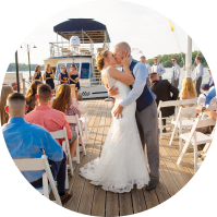 Bride and groom kissing on Miss Lotta water taxi